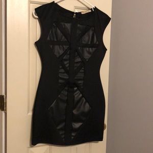 Black mini dress with leather abstract.